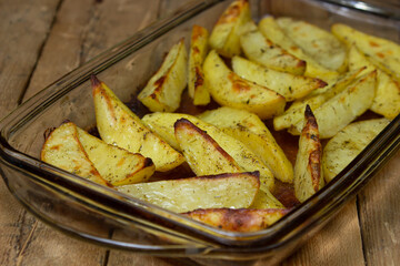 Fried potato wedges. Homemade fried food. Fried vegetables. Tasty food.