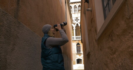 Fototapeta premium Woman trying to find a place for good shot