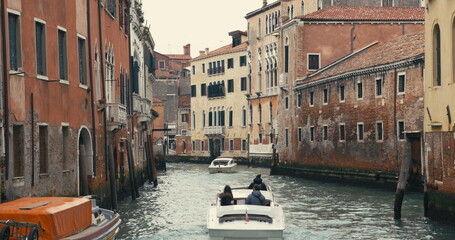 Fototapeta na wymiar Moving Traffic on Water Canals in Venice, Italy