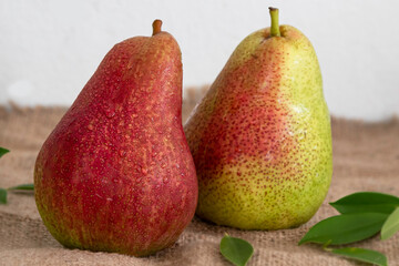 Close up ripe red pears put on handmade cloth white background.