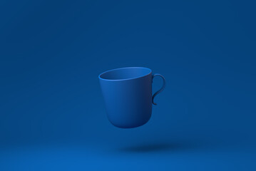 Blue Mugs or Coffee cup floating in blue background. minimal concept idea creative. monochrome. 3D render.