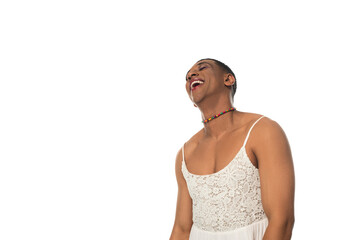excited african american transvestite man in makeup and sundress laughing isolated on white