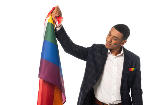 african american businessman holding lgbt flag isolated on white