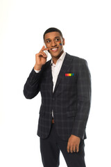 smiling african american businessman with lgbt flag painted on face talking on smartphone isolated...