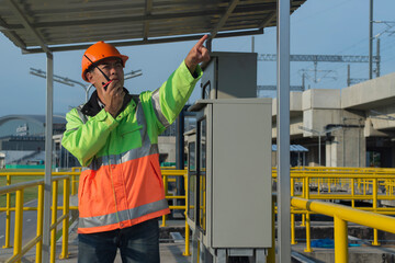 construction worker on a site. engineer Contactor using radio communication  on site construction...