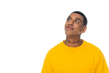 dreamy and positive african american man in rainbow colors necklace isolated on white, lgbt concept