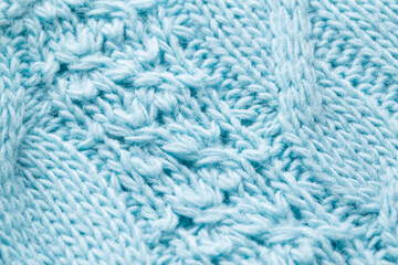 knitted winter blue sweater, handmade. Macro, fabric