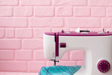 Designer work place sewing machine in office.