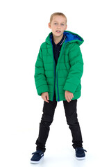 Fototapeta premium Smiling boy in unbuttoned green winter jacket