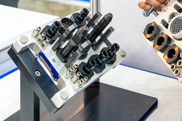 Technician holding assistance mounting of multi coupling with connection or high pressure hose...