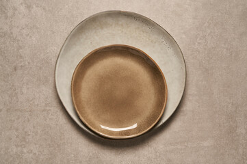 
brown ceramic plate and bowl