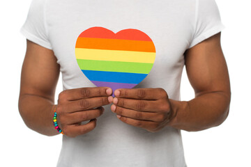 partial view of african american man showing lgbt colors paper heart isolated on white