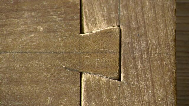 Close-up of dove-tail wood joint.