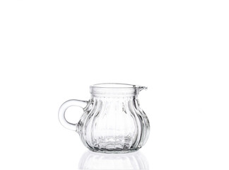 Empty glass jug isolated on white background