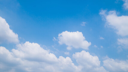 Naklejka na ściany i meble white clouds against the blue sky in summer