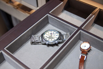 Wrist watches in a velvet storage box, luxury lifestyle