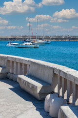 Small port of Santa Maria di Leuca, southern Italy. Apulia (Italian region). Balcony with sea view and some boat.
