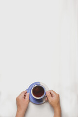 flat lay both hands holding the cup