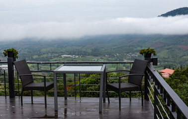 ables and chairs in the cafe. see the scenery on the mountain and foggy