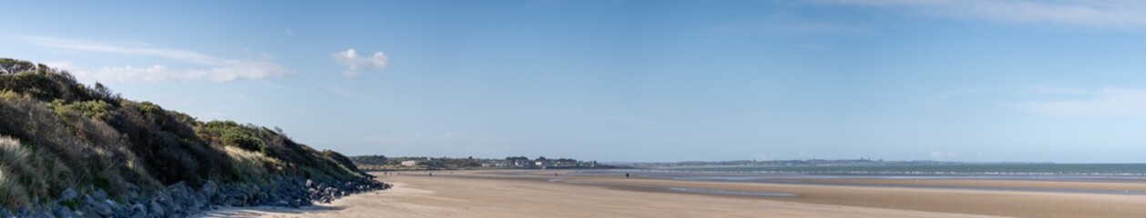 Panoramic view of Portmarnock beach, County Dublin, Ireland. Vivid colors,Copy space for text holiday background.