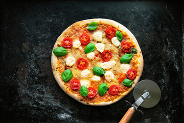Crispy italian pizza with ricotta, tomatoes and basil