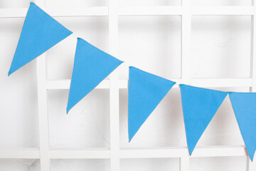 Festive blue flags on a white background. birthday. childhood. decor.