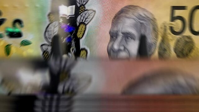Money counting machine with Australian Dollar banknotes. Business, economy, banking and finance. Abstract concept loopable and seamless animation. Fast AUD currency rotation.