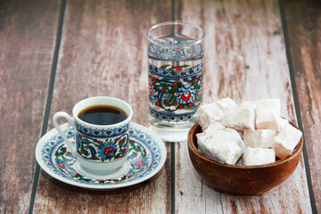black turkish coffee in a mug and sweet lukum