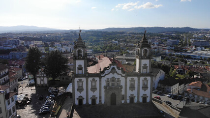 Fototapeta na wymiar Viseu, Portugal - May 8, 2021: DRONE AERIAL VIEW - Front facade at the Church of Mercy, Igreja da Misericordia, baroque style monument, architectural icon of the city of Viseu, in Portugal.