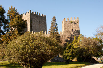 Fototapeta na wymiar The 10th Century Guimaraes Castle (Castelo de Guimaraes) in Guimaraes Portugal, considered the most famous castle in the country 
