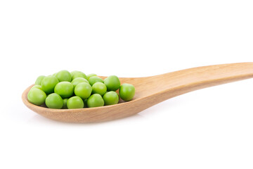 Green peas  in wooden spoon isolated on white background.