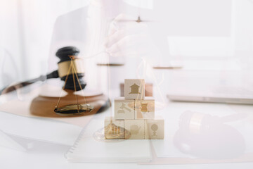 Business and lawyers discussing contract papers with brass scale on desk in office. Law, legal services, advice, justice and law concept