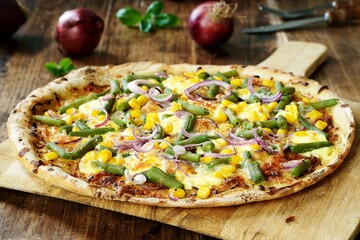 Fresh homemade pizza with green beans, corn, read onion rings and hollandaise sauce - 433278268