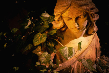 Beautiful angel. Vintage styled image of ancient stone statue.