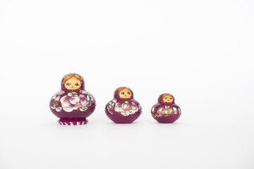 Tree purple cute matryoshka dolls, close up