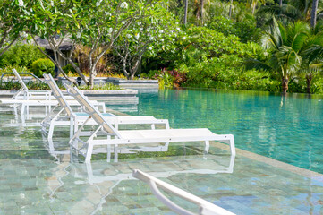 Beautiful view of swimming pool with Green tropical garden in cozy resort, phi phi island, Thailand
