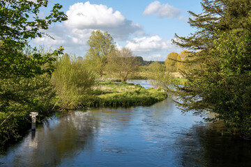 Fototapeta na wymiar Stockbridge, Hampshire, England, UK. 2021. The River Test as it winds its way through Stockbridge in the heart of the Test Valley, Hampshire, UK