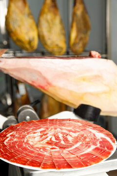 Slices of fresh Iberian ham at butcher's shop