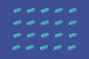 Light blue pills arranged on a neutral background. Medication for male impotence.