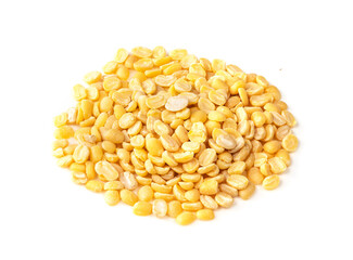 handful of raw moong dal beans closeup on white