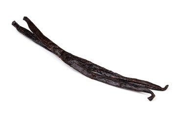two different dried vanilla beans closeup on white