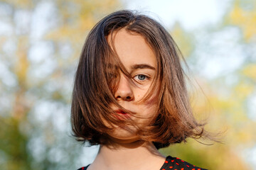 Teenage girl with gray eyes during sunny day