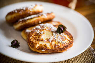 sweet fried cottage cheese pancakes in a plate