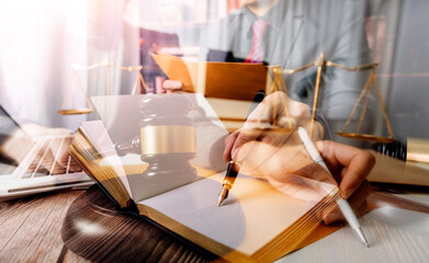 Justice and law concept.Male judge in a courtroom with the gavel, working with, computer and...