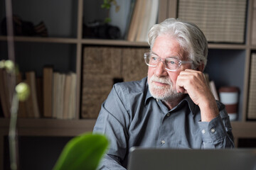 Contemplating businessman looking away