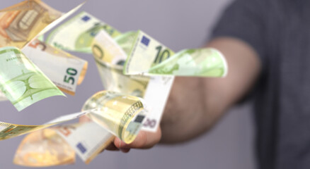 banking euro banknote in hand rain
