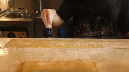 handmade fresh pasta making process. close up