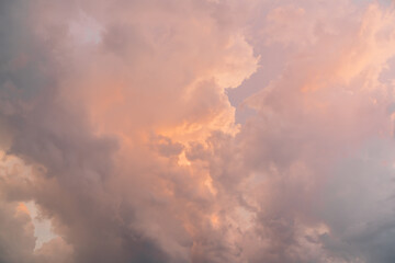 Colorful fluffy clouds on sky during sunset