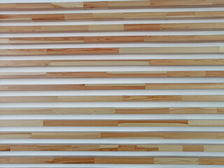 Polished narrow boards nailed to the wall