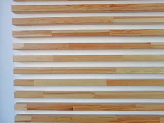 Polished narrow boards nailed to the wall